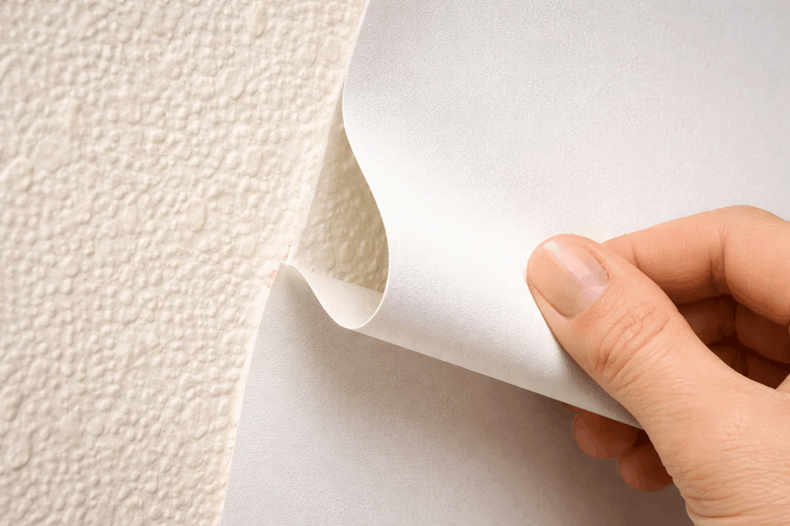 Why peel and stick wallpaper fails on textured orange peel walls in rental units.